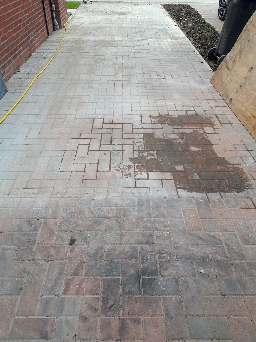 dirty driveway before pressure cleaning