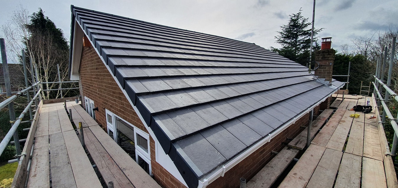 Grey roof on brick bungalow