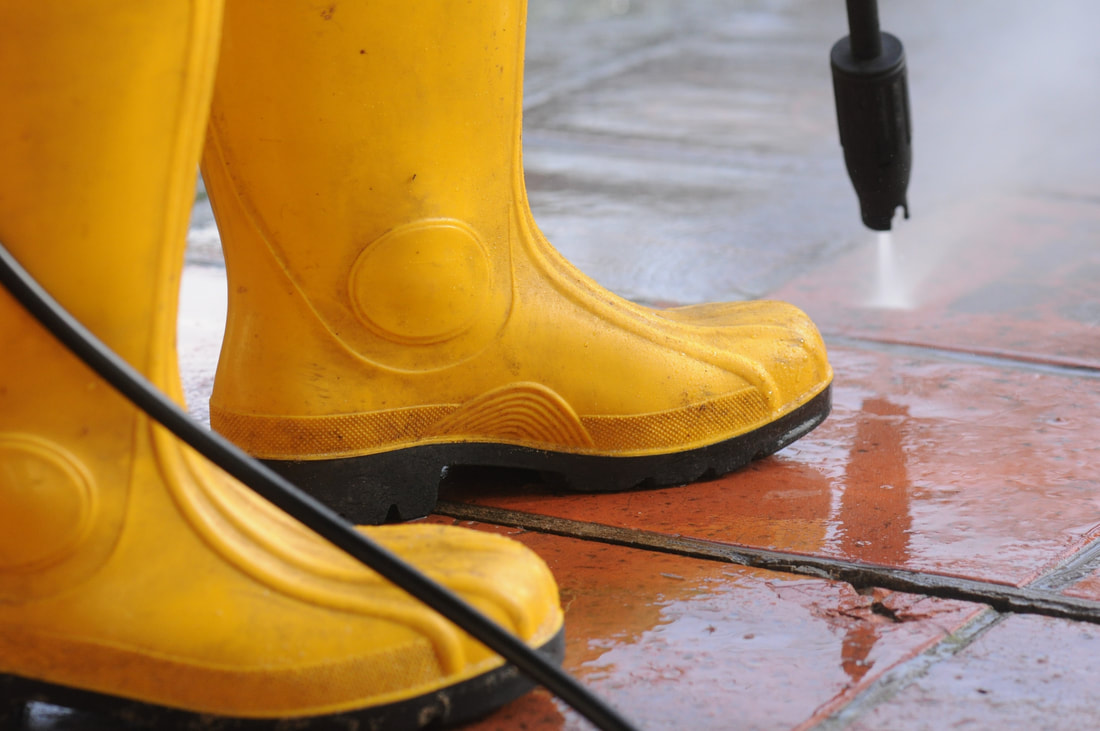 Pressure washing in progress