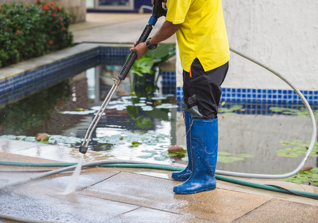 Pressure washing a pool surround